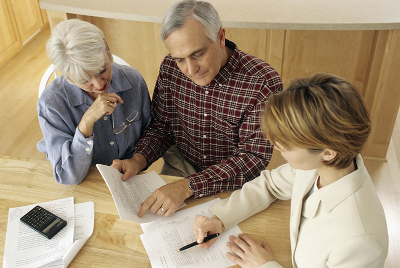 Family reviewing estate planning documents with their attorney